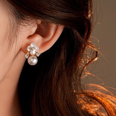 Angled view of the 14K Gold-Plated 2025 Elegant Zircon Flower Pearl Earrings