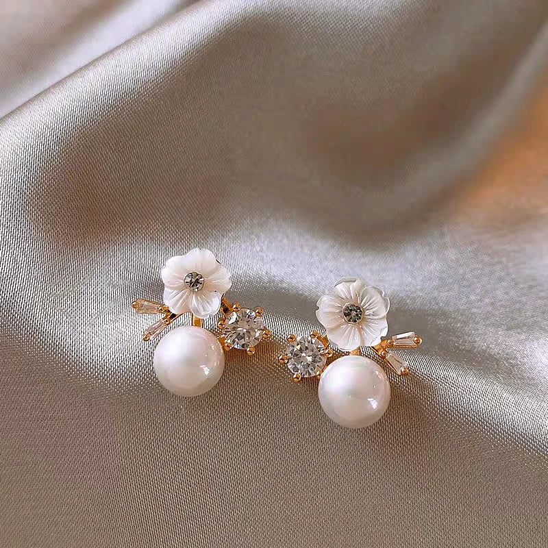 Angled view of the 14K Gold-Plated 2025 Elegant Zircon Flower Pearl Earrings