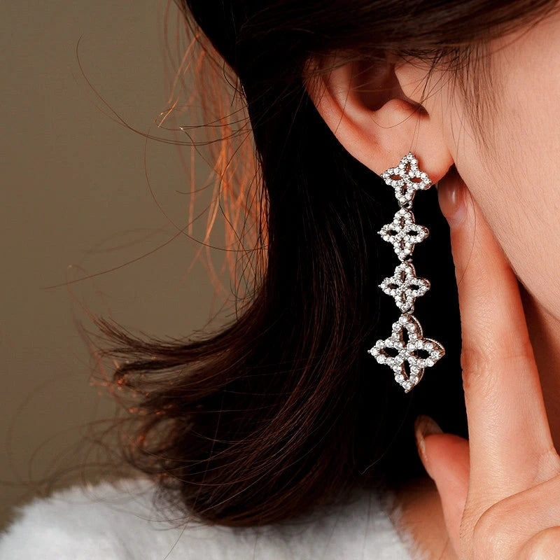 Angled view of the 14K Gold-Plated 2025 Elegant Zircon Flower Tassel Earrings