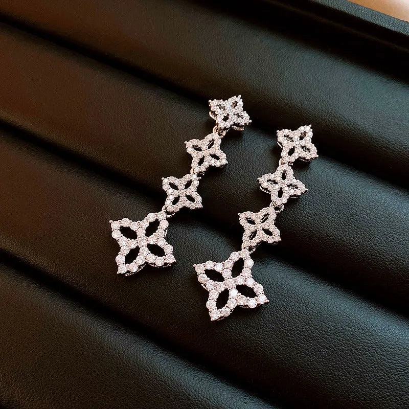 Model showcasing the dangle and style of the 14K Gold-Plated 2025 Elegant Zircon Flower Tassel Earrings