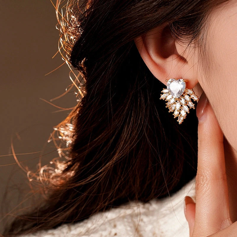 Close-up detail of the sparkling zircons and plating on the silver heart earrings