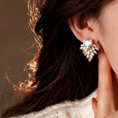 Close-up detail of the sparkling zircons and plating on the silver heart earrings