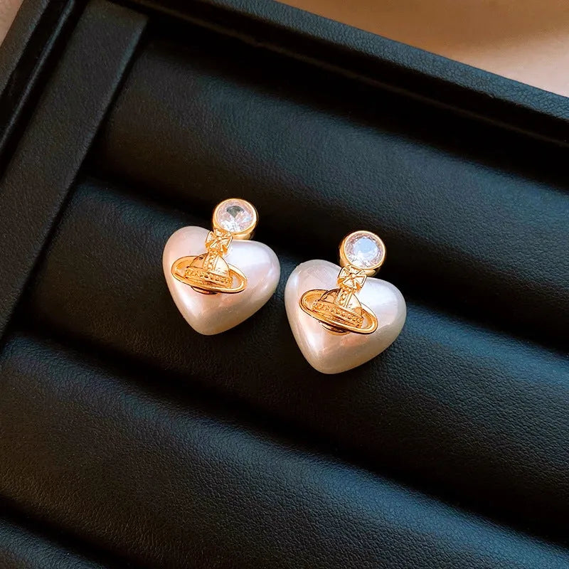 Close-up detail of the sparkling zircons and plating on the saturn earrings