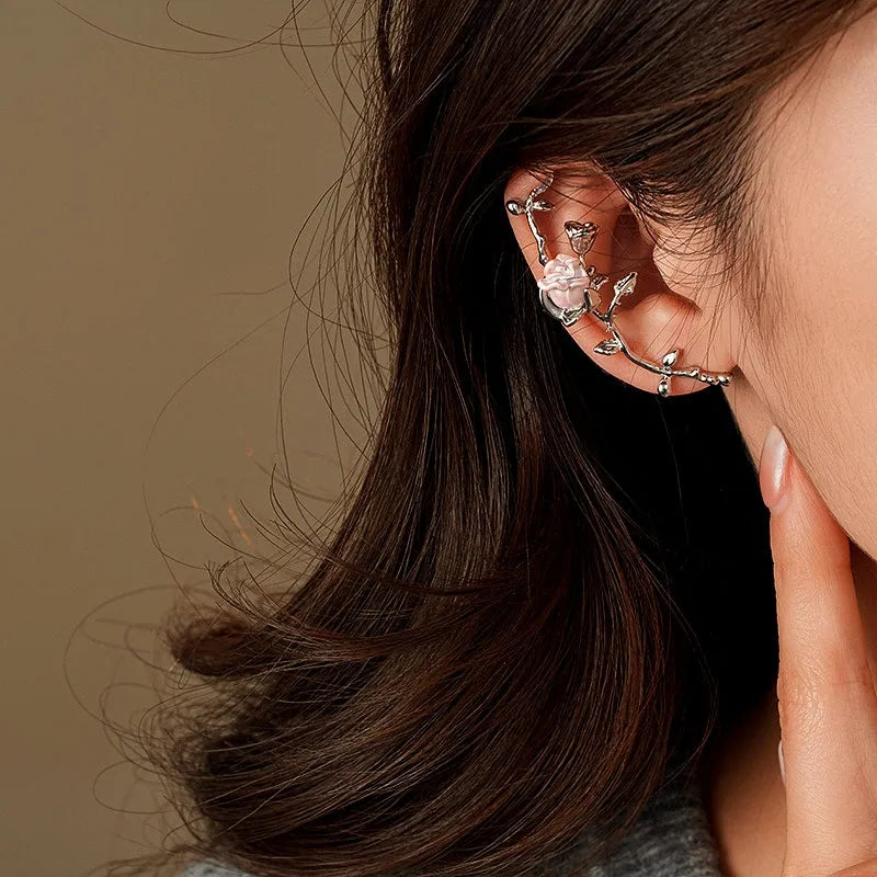 Close-up detail of the sparkling zircons and plating on the silver crawler earrings