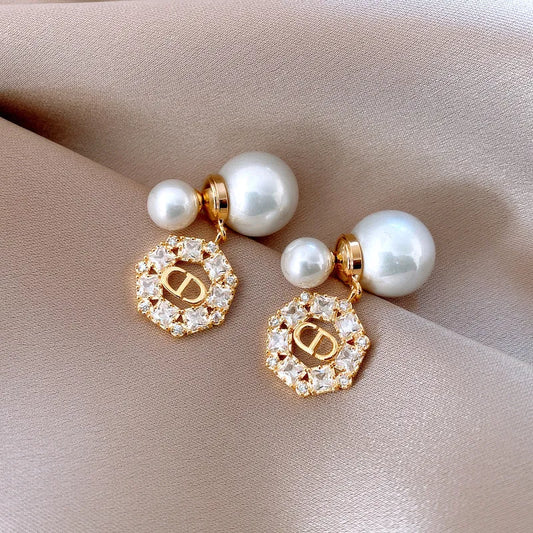 Model showcasing the dangle and style of the 14K Gold-Plated 2025 Elegant Zircon Round Pig Nose Pearl Earrings