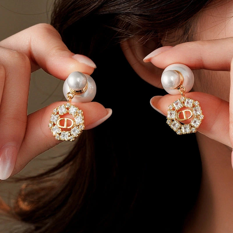 Angled view of the 14K Gold-Plated 2025 Elegant Zircon Round Pig Nose Pearl Earrings