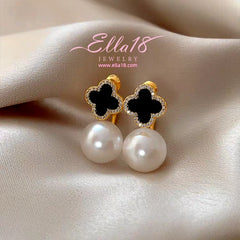 Model showcasing the dangle and style of the 14K Gold-Plated 2025 New Luxury Four-Leaf Flower Pearl Jacket Earrings