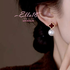 Angled view of the 14K Gold-Plated 2025 New Luxury Four-Leaf Flower Pearl Jacket Earrings