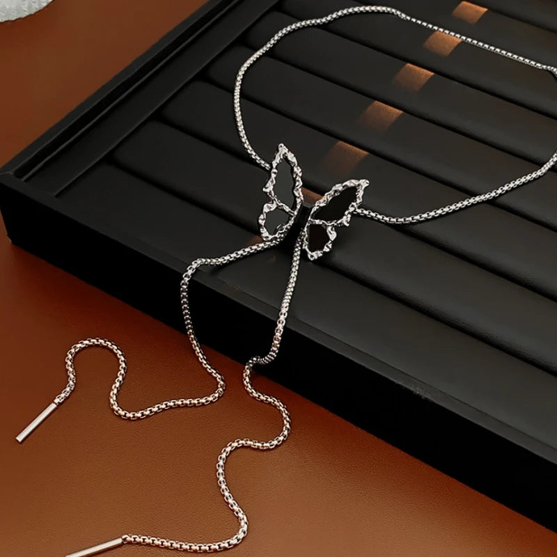 Close-up of the pendant and clasp on the silver butterfly necklace