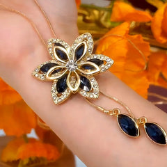 14K Gold-Plated Adjustable Flower Tassel Sweater Chain Necklace worn to showcase its length and pendant detail