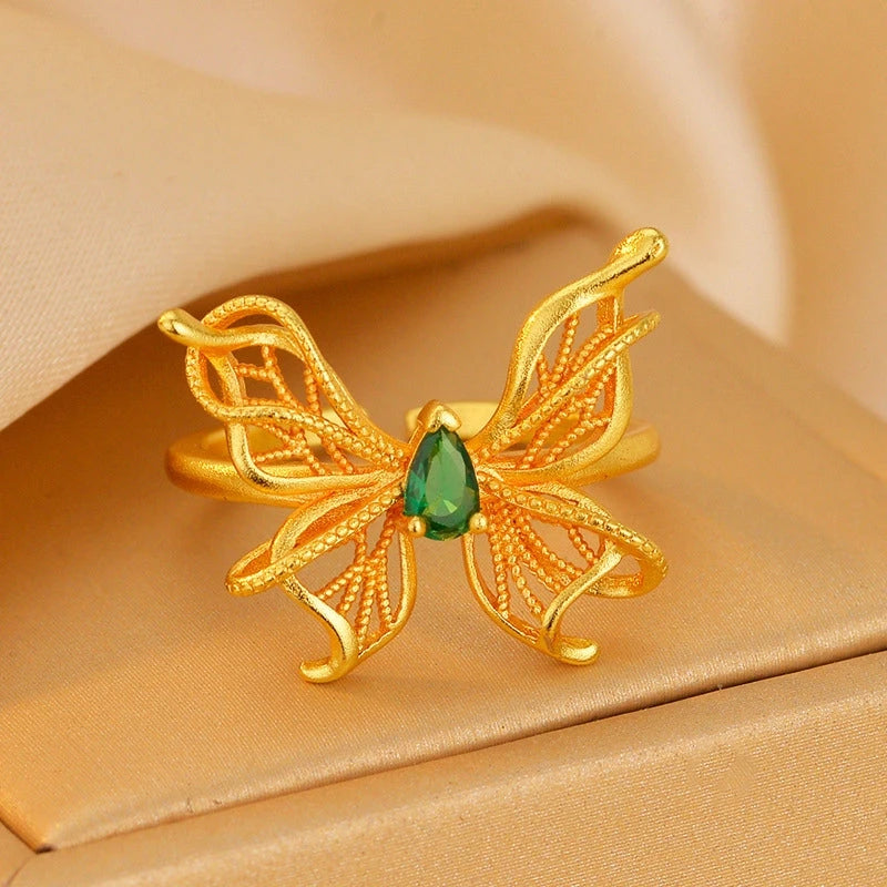 14K Gold-Plated Adjustable Green Diamond Hollow Filigree Butterfly Rings worn on the hand to show its beautiful fit and design