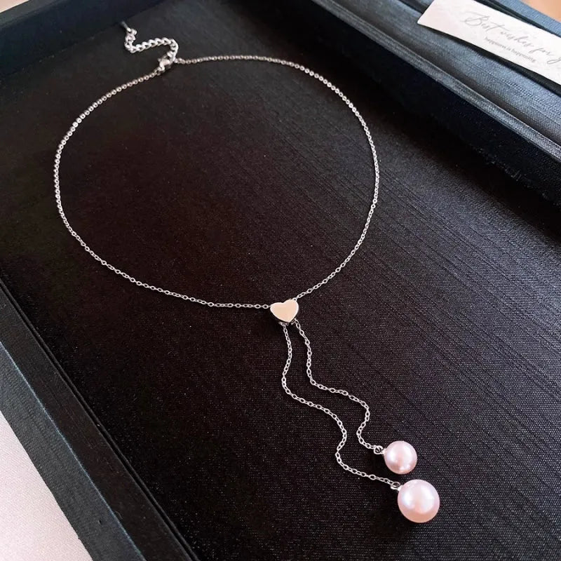 14K Gold-Plated Adjustable Heart Pearl Tassel Necklace worn to showcase its length and pendant detail