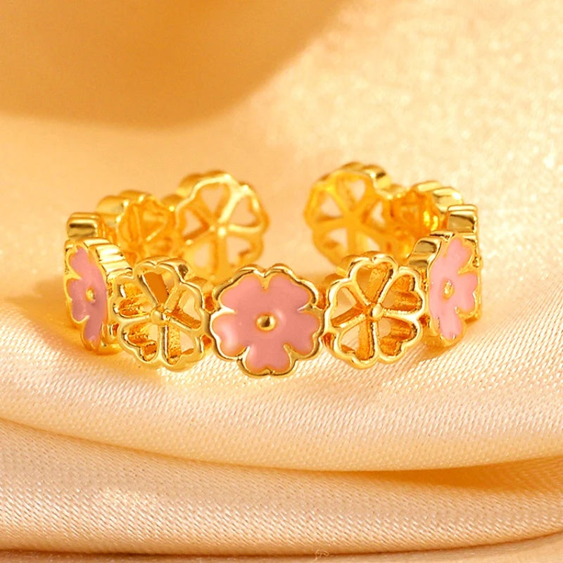 14K Gold-Plated Adjustable Hollow Cherry Blossom Rings worn on the hand to show its beautiful fit and design