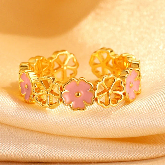 14K Gold-Plated Adjustable Hollow Cherry Blossom Rings worn on the hand to show its beautiful fit and design