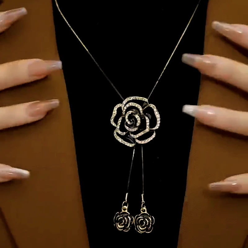 Detailed view of the 14K Gold-Plated Adjustable Rose Sweater Chain Necklace chain and pendant