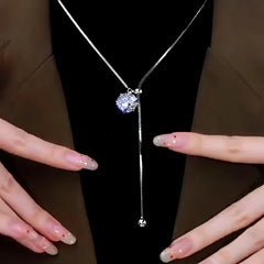 Detailed view of the 14K Gold-Plated Adjustable Zircon And Diamond Necklace chain and pendant