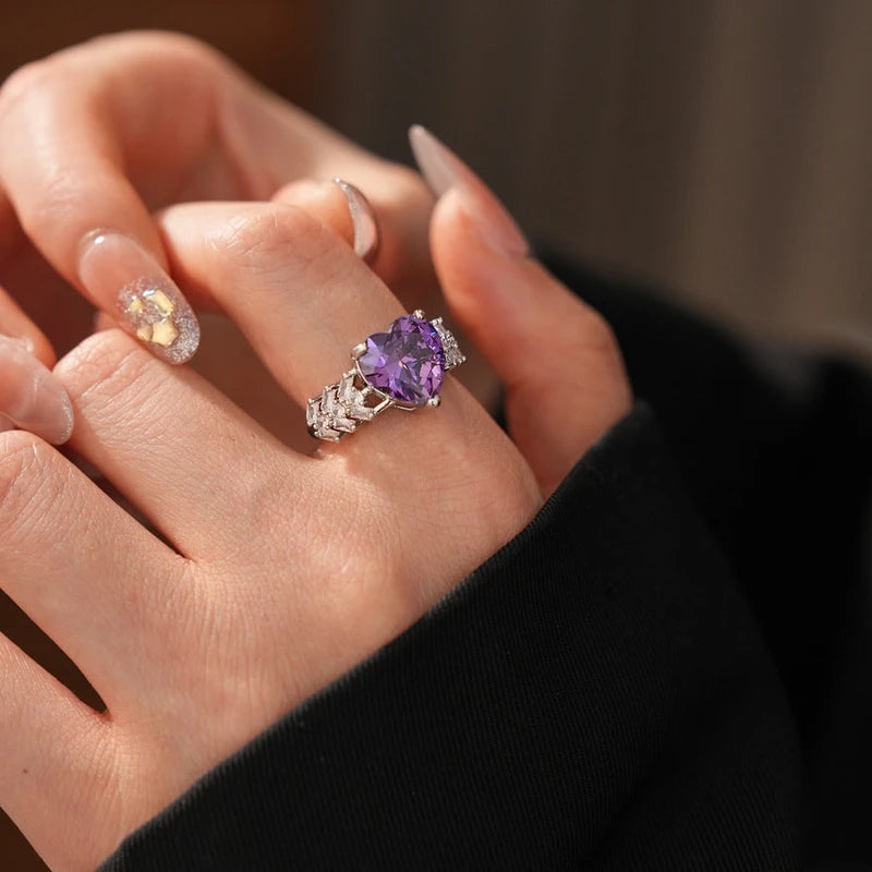 Close-up view of the gemstone and setting of the gold heart ring