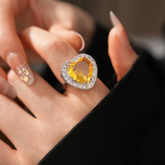 Close-up view of the gemstone and setting of the gold heart ring