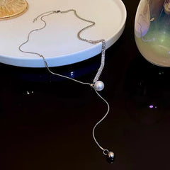 Close-up of the pendant and clasp on the silver pearl necklace