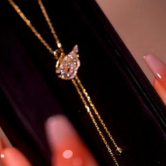 Detailed view of the 14K Gold-Plated Adjustable Zircon Swan Necklace chain and pendant