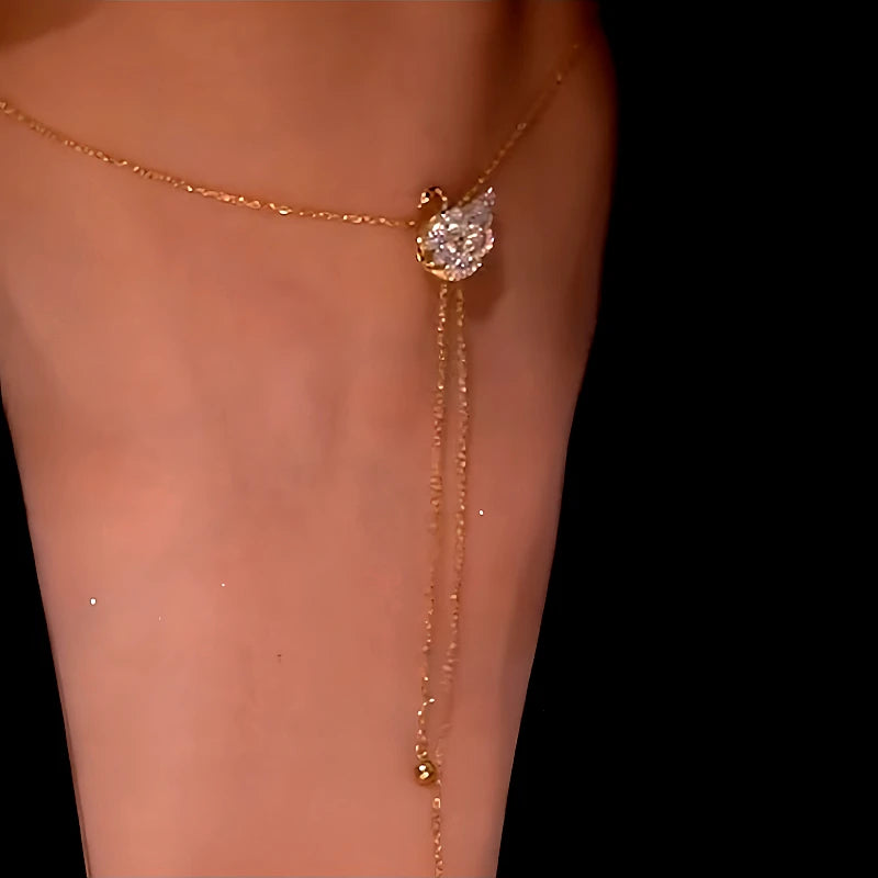 Close-up of the pendant and clasp on the gold swan necklace