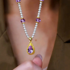 Close-up of the pendant and clasp on the amethyst pearl necklace