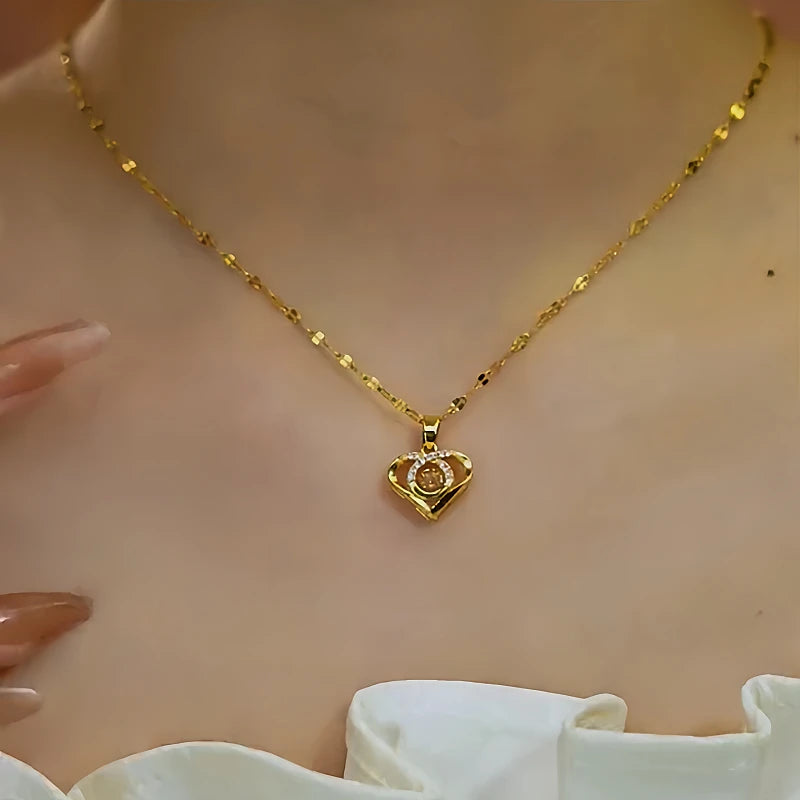 Close-up of the pendant and clasp on the gold heart necklace