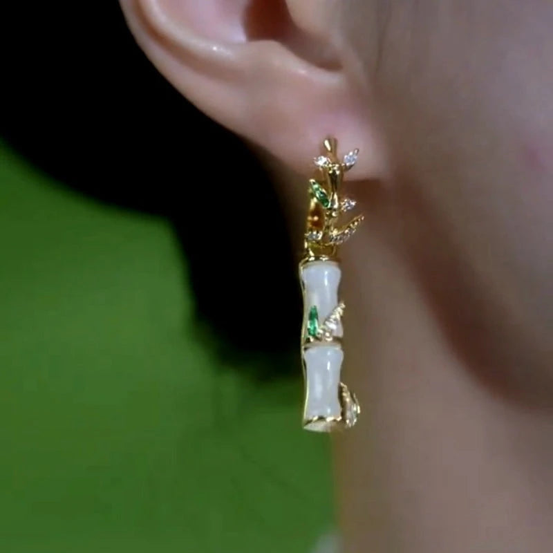 Close-up detail of the sparkling zircons and plating on the gold bamboo earrings