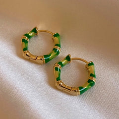 Angled view of the 14K Gold-Plated Bamboo Hoop Earrings