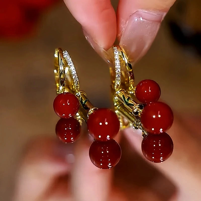 Close-up detail of the sparkling zircons and plating on the gold pearl earrings