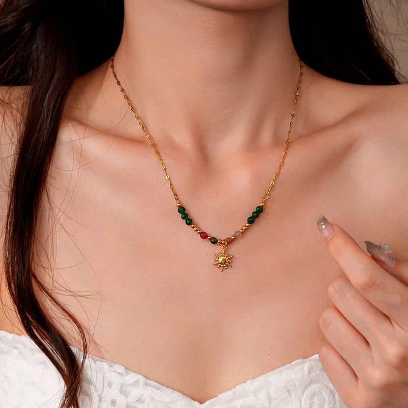 Detailed view of the 14K Gold-Plated Beaded Sun Necklace chain and pendant