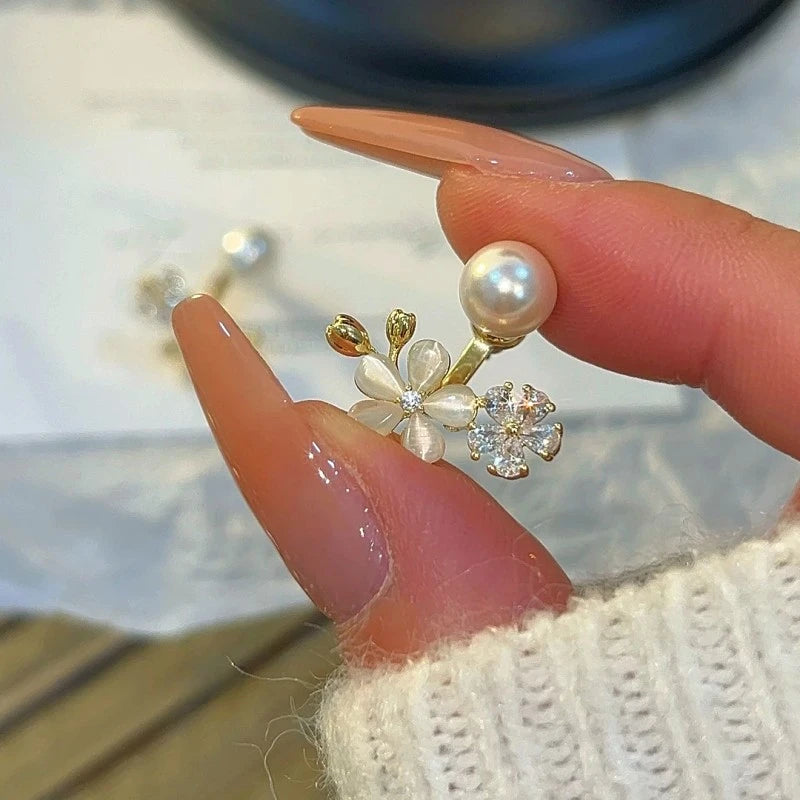Close-up detail of the sparkling zircons and plating on the gold flower earrings