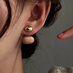 Close-up detail of the sparkling zircons and plating on the red drop earrings