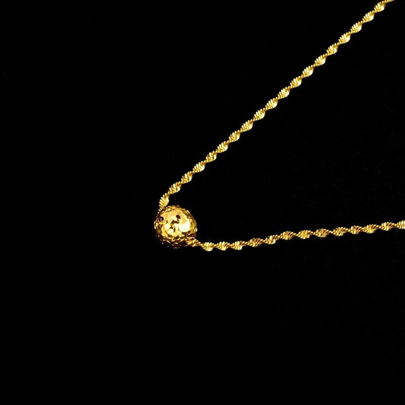 Detailed view of the 14K Gold-Plated Bean Pendant Necklace chain and pendant
