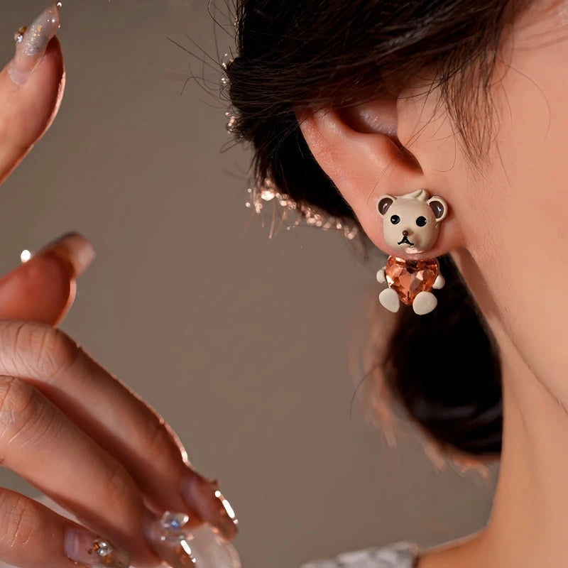 Close-up detail of the sparkling zircons and plating on the silver heart earrings