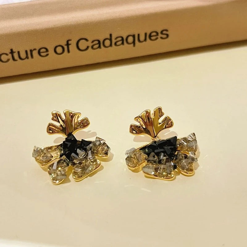 Close-up detail of the sparkling zircons and plating on the Ginkgo Leaf Earrings