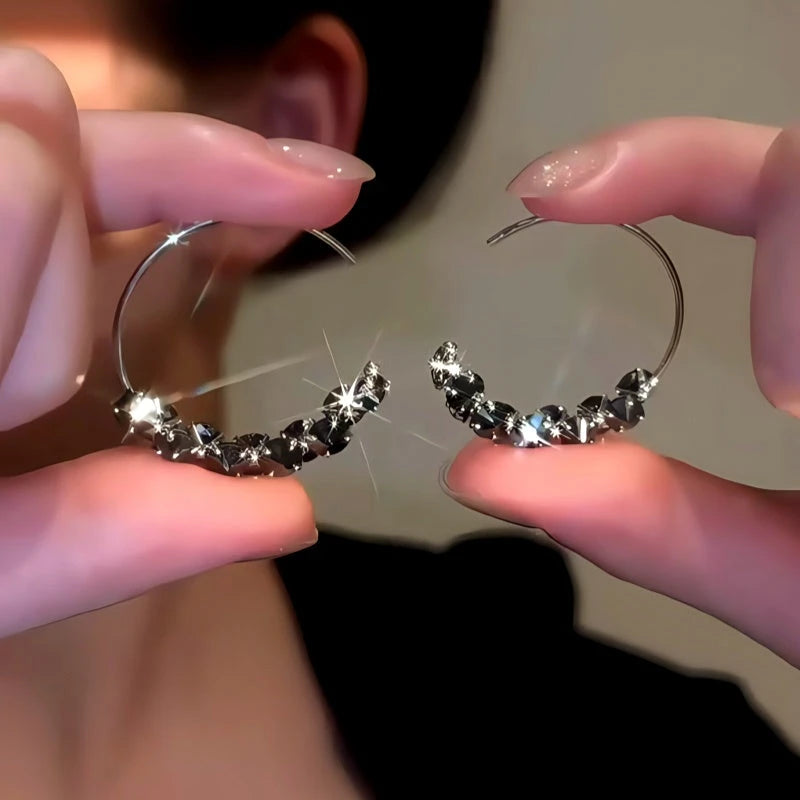 Angled view of the 14K Gold-Plated Black Diamond Threader Earrings