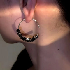 Close-up detail of the sparkling zircons and plating on the Black Threader Earrings