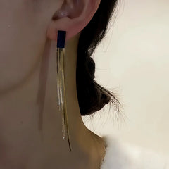 Model showcasing the dangle and style of the 14K Gold-Plated Black Jade Tassel Earrings