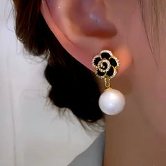 Close-up detail of the sparkling zircons and plating on the Black Rose Earrings