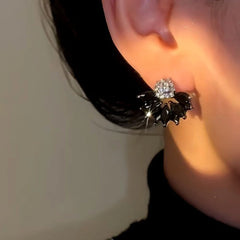 Close-up detail of the sparkling zircons and plating on the Zircon Flower Earrings