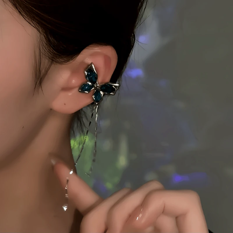 Model showcasing the dangle and style of the 14K Gold-Plated Blue Butterfly Tassel Ear Cuffs ( 1 Pair )