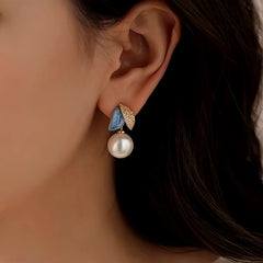 Close-up detail of the sparkling zircons and plating on the Camellia Pearl Earrings