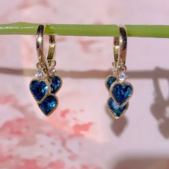 Close-up detail of the sparkling zircons and plating on the Heart Tassel Earrings