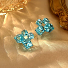 Angled view of the 14K Gold-Plated Blue Crystal Stud Earrings