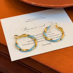 Close-up detail of the sparkling zircons and plating on the Blue Hoop Earrings
