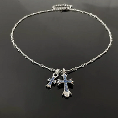 Close-up of the pendant and clasp on the Cross Necklace