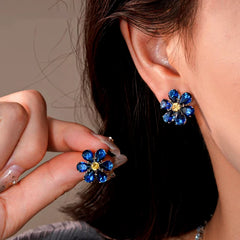 14K Gold-Plated Blue Zircon Diamond Flower Necklace And Earrings Set worn to showcase its length and pendant detail
