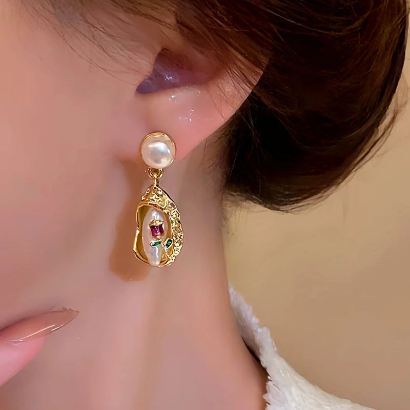 Model showcasing the dangle and style of the 14K Gold-Plated Bouquet Pearl Earrings