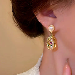 Angled view of the 14K Gold-Plated Bouquet Pearl Earrings